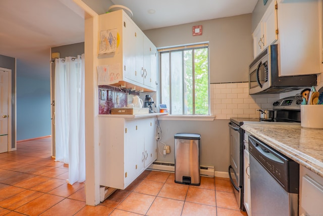 95 Park Ave Apt 14, Danbury, CT 06810 - kitchen with appliances with stainless steel finishes, white cabinets, light countertops, light tile patterned floors, and a baseboard radiator