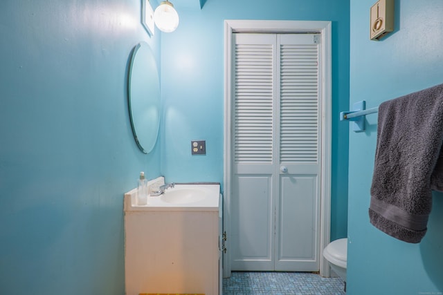 95 Park Ave Apt 14, Danbury, CT 06810 - bathroom featuring a closet, vanity, toilet, and tile patterned floors