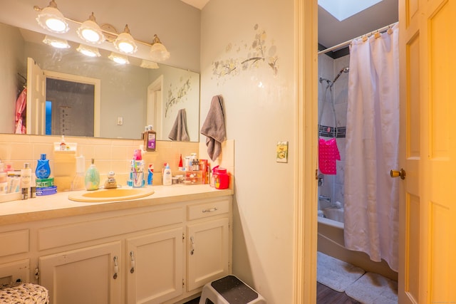 95 Park Ave Apt 14, Danbury, CT 06810 - full bath featuring vanity, decorative backsplash, shower / tub combo with curtain, and a skylight