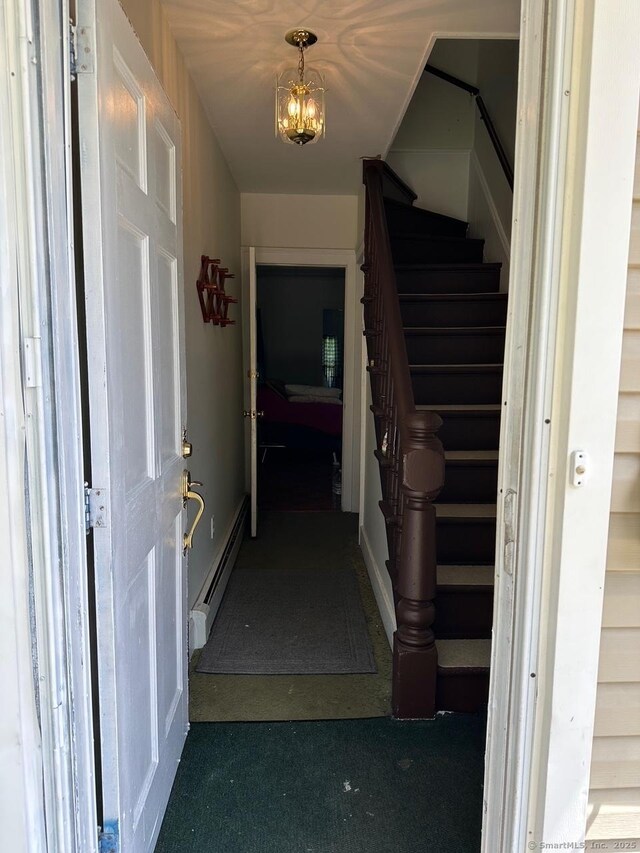 59 Rowan St, Danbury, CT 06810 - hall with stairs, a baseboard radiator, a chandelier, and carpet