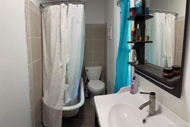 59 Rowan St, Danbury, CT 06810 - full bathroom with tile walls, toilet, a sink, and tile patterned floors