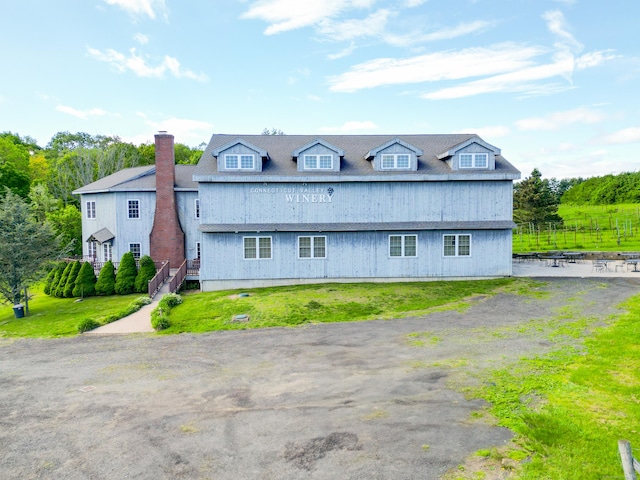 1480 Litchfield Tpke, New Hartford, CT 06057 - back of house with a chimney and a lawn