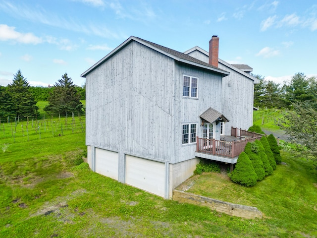 1480 Litchfield Tpke, New Hartford, CT 06057 - rear view of house with a chimney, a deck, a lawn, and a shingled roof