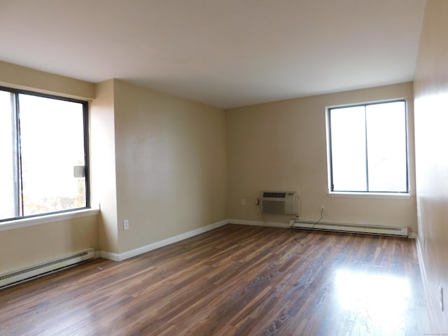 356 Franklin Ave Apt C1, Hartford, CT 06114 - empty room with a baseboard radiator, a wall unit AC, plenty of natural light, and wood finished floors