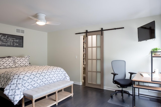 504 Harvest Commons Unit 504, Westport, CT 06880 - bedroom featuring a barn door, dark wood-style floors, baseboards, a desk, and a ceiling fan