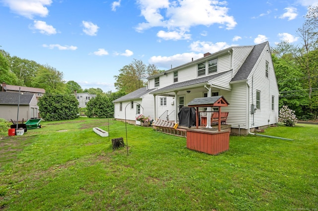 45 S Eagle St, Plymouth, CT 06786 - rear view of property with a yard, a chimney, a wooden deck, and a shingled roof