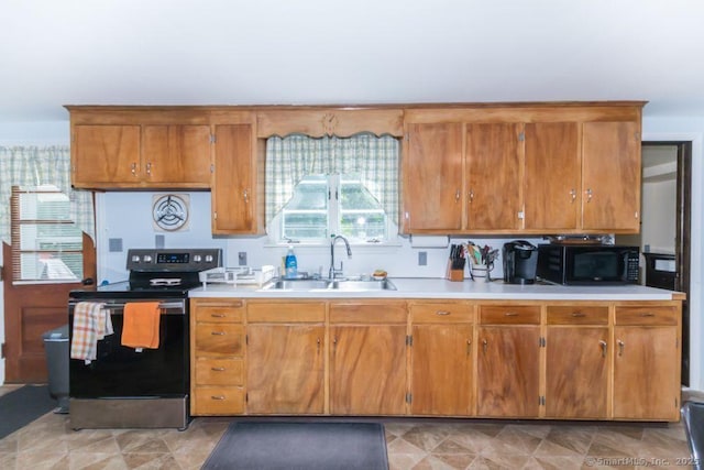 45 S Eagle St, Plymouth, CT 06786 - kitchen with electric range, a sink, black microwave, and light countertops