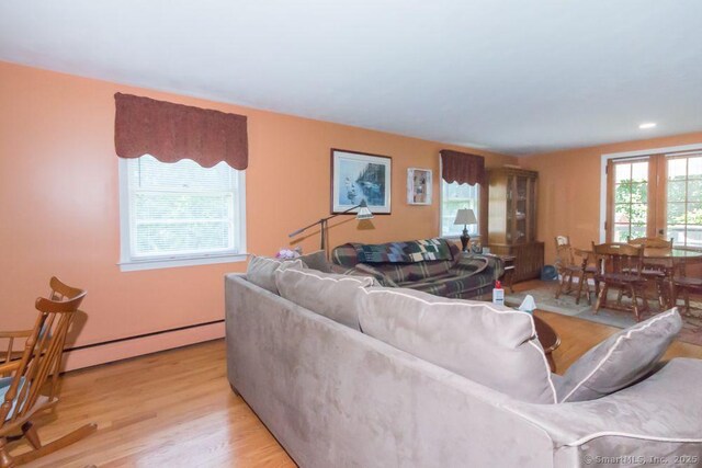 45 S Eagle St, Plymouth, CT 06786 - living area featuring light wood-style floors and a baseboard radiator