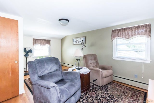 45 S Eagle St, Plymouth, CT 06786 - living area featuring a baseboard heating unit and wood finished floors