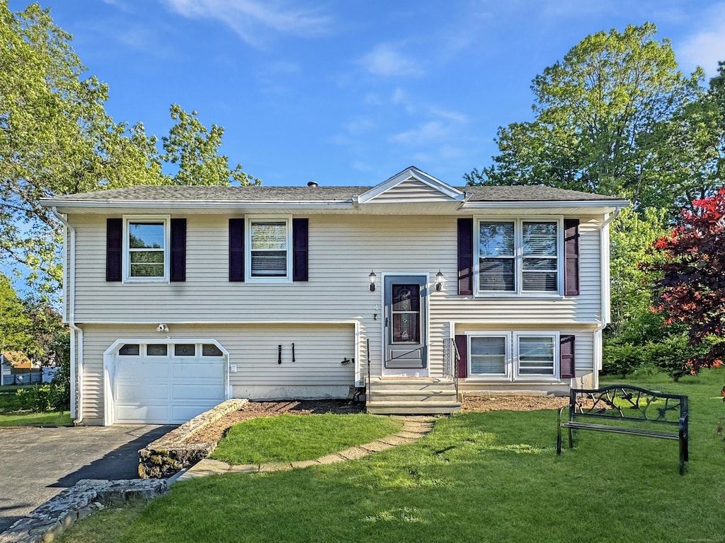 4 Hemlock Rd, Naugatuck, CT 06770 - raised ranch featuring driveway, an attached garage, a front yard, and entry steps