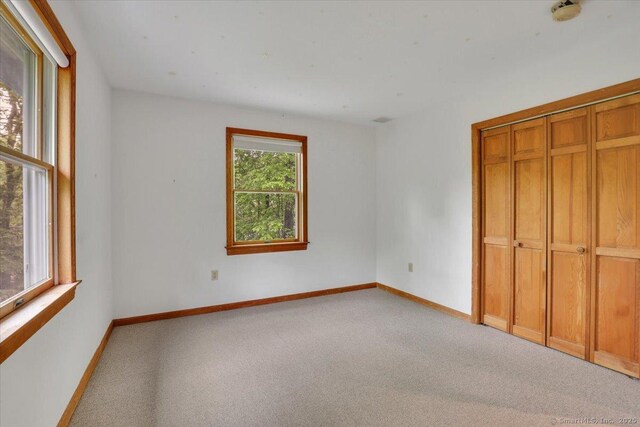 1155 Arbutus St, Middletown, CT 06457 - unfurnished bedroom featuring carpet flooring, baseboards, and a closet