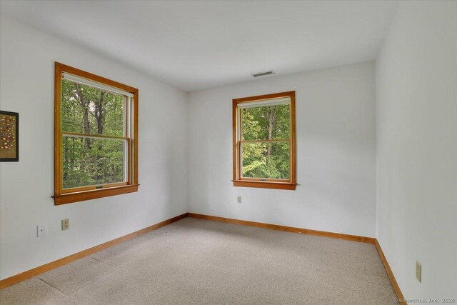 1155 Arbutus St, Middletown, CT 06457 - carpeted spare room featuring plenty of natural light and baseboards