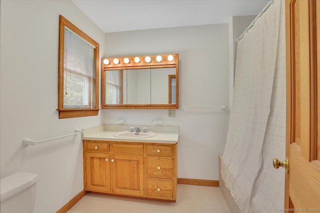1155 Arbutus St, Middletown, CT 06457 - full bathroom with baseboards, toilet, vanity, and curtained shower