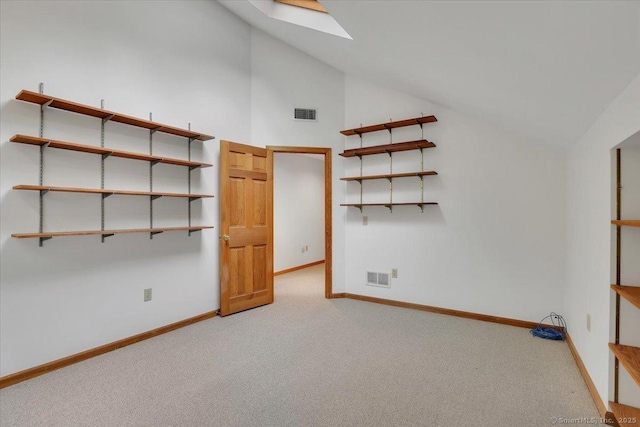 1155 Arbutus St, Middletown, CT 06457 - carpeted spare room featuring baseboards, a skylight, and high vaulted ceiling