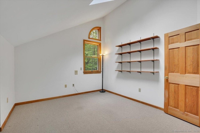 1155 Arbutus St, Middletown, CT 06457 - additional living space with carpet, baseboards, high vaulted ceiling, and a skylight