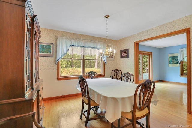1155 Arbutus St, Middletown, CT 06457 - dining room with wallpapered walls, light wood-type flooring, a chandelier, and baseboards