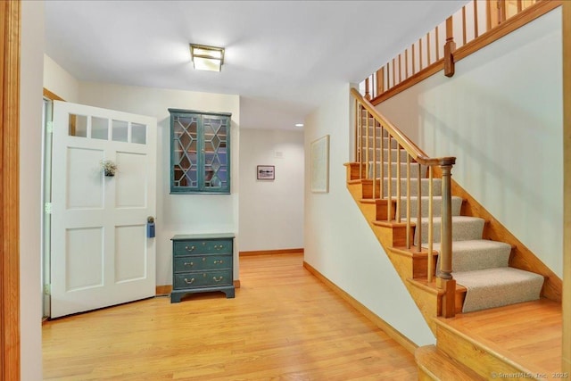 1155 Arbutus St, Middletown, CT 06457 - entrance foyer featuring light wood-style flooring, stairway, and baseboards