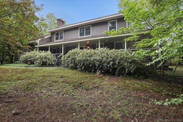 1155 Arbutus St, Middletown, CT 06457 - view of front of property featuring a chimney and covered porch