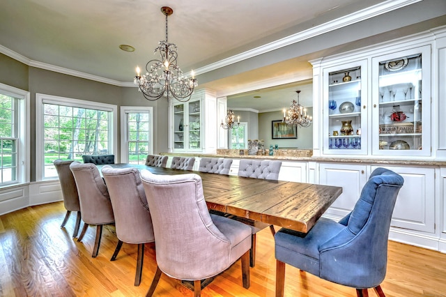 10 Grove Hill Rd, Woodbridge, CT 06525 - dining area featuring a chandelier, ornamental molding, and light wood-style flooring
