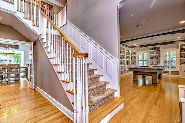 10 Grove Hill Rd, Woodbridge, CT 06525 - stairs with crown molding, wood finished floors, pool table, healthy amount of natural light, and built in features