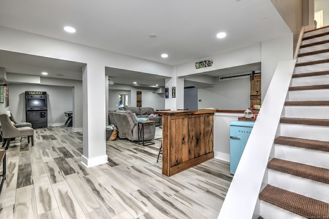 10 Grove Hill Rd, Woodbridge, CT 06525 - kitchen with a barn door, light wood-type flooring, recessed lighting, baseboards, and open floor plan