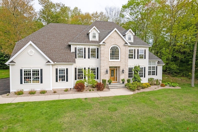 64 Warren Gln, Burlington, CT 06013 - view of front facade with a front yard and roof with shingles