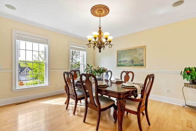 64 Warren Gln, Burlington, CT 06013 - dining space featuring a chandelier, crown molding, light wood-type flooring, and baseboards