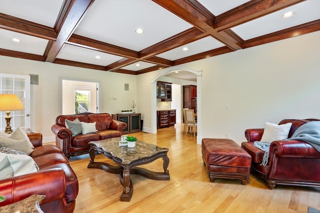 64 Warren Gln, Burlington, CT 06013 - living area featuring arched walkways, coffered ceiling, light wood-style floors, beam ceiling, and baseboards