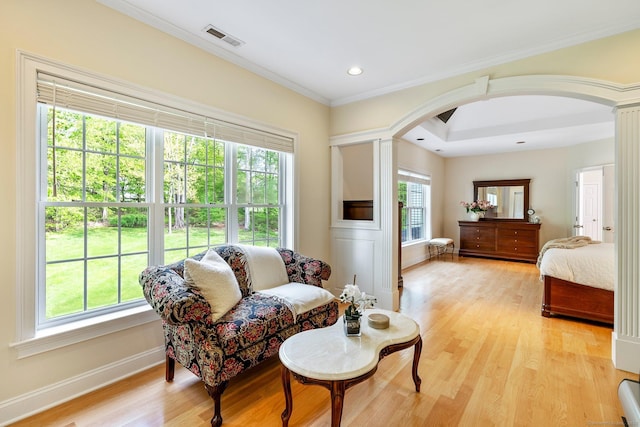 64 Warren Gln, Burlington, CT 06013 - living area featuring arched walkways, light wood-type flooring, ornamental molding, baseboards, and recessed lighting