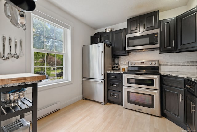 745 Merrow Rd Apt 113, Coventry, CT 06238 - kitchen featuring appliances with stainless steel finishes, healthy amount of natural light, and dark cabinets