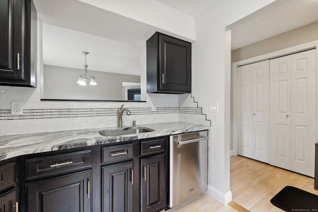 745 Merrow Rd Apt 113, Coventry, CT 06238 - kitchen featuring a sink, stainless steel dishwasher, backsplash, and light wood-style floors