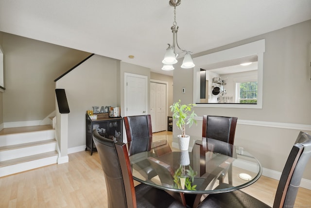745 Merrow Rd Apt 113, Coventry, CT 06238 - dining space featuring stairs, light wood finished floors, and baseboards