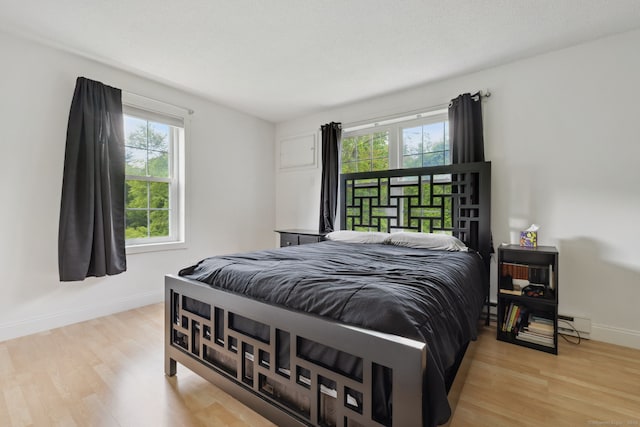 745 Merrow Rd Apt 113, Coventry, CT 06238 - bedroom featuring light wood finished floors and baseboards