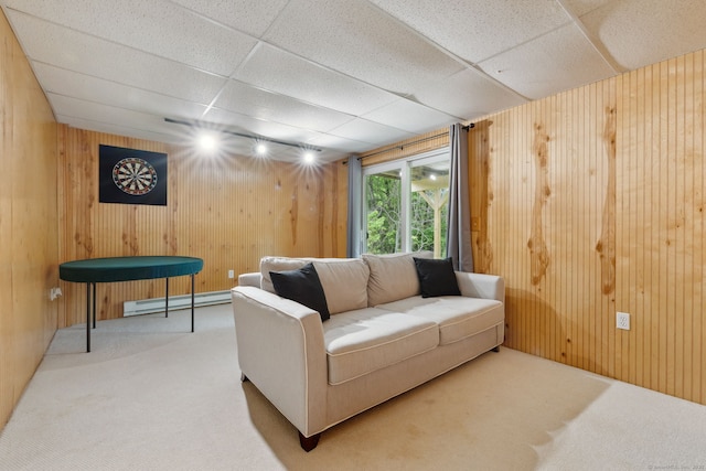 745 Merrow Rd Apt 113, Coventry, CT 06238 - living area featuring a baseboard radiator, carpet floors, wooden walls, and a paneled ceiling