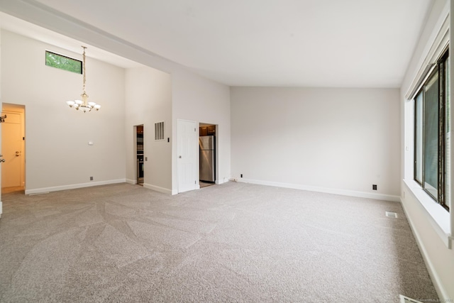 19 Keeler Close Close Unit 19, Ridgefield, CT 06877 - unfurnished room featuring a chandelier, light carpet, baseboards, and high vaulted ceiling