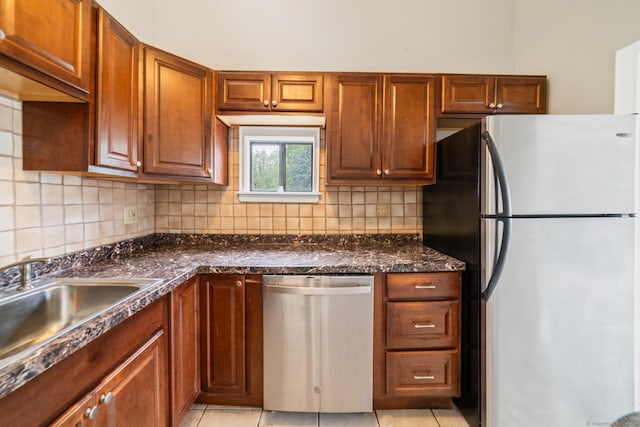 19 Keeler Close Close Unit 19, Ridgefield, CT 06877 - kitchen with stainless steel appliances, a sink, decorative backsplash, and light tile patterned floors