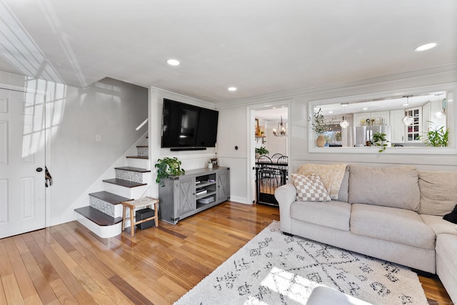 17 Saint Thomas St, Enfield, CT 06082 - living room with light wood-style floors, stairway, crown molding, and recessed lighting