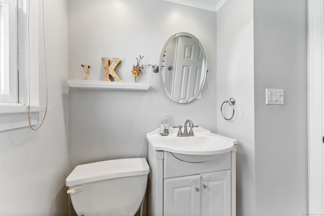 17 Saint Thomas St, Enfield, CT 06082 - bathroom with vanity, toilet, and crown molding