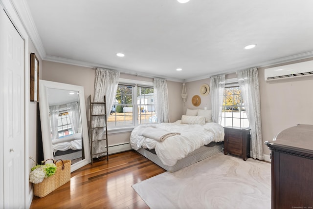 17 Saint Thomas St, Enfield, CT 06082 - bedroom featuring a wall mounted AC, ornamental molding, wood finished floors, recessed lighting, and baseboard heating