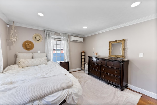 17 Saint Thomas St, Enfield, CT 06082 - bedroom with an AC wall unit, ornamental molding, baseboards, light wood finished floors, and recessed lighting