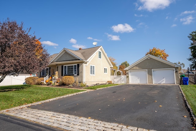 17 Saint Thomas St, Enfield, CT 06082 - view of front of house with a garage and a chimney