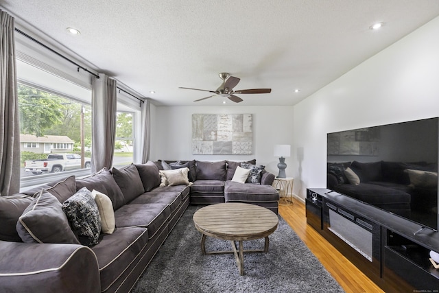 53 Roosevelt Blvd, Enfield, CT 06082 - living area with light wood-type flooring, a ceiling fan, a textured ceiling, and recessed lighting