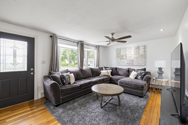 53 Roosevelt Blvd, Enfield, CT 06082 - living area featuring a baseboard heating unit, light wood finished floors, ceiling fan, and recessed lighting