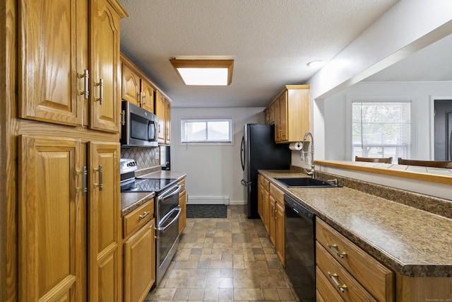 53 Roosevelt Blvd, Enfield, CT 06082 - kitchen with stainless steel appliances, a sink, baseboard heating, baseboards, and brown cabinetry