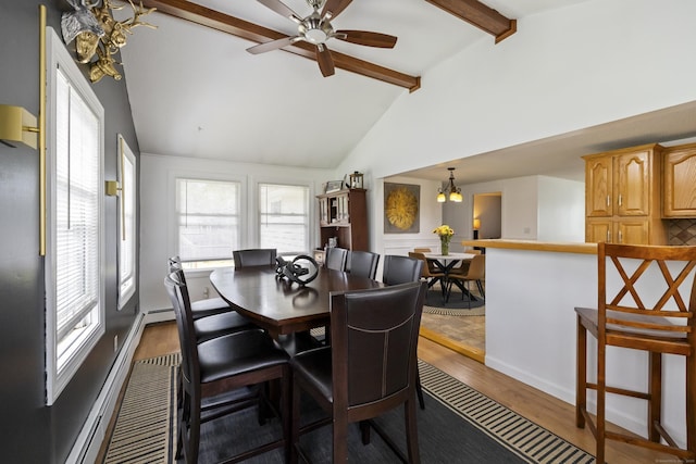 53 Roosevelt Blvd, Enfield, CT 06082 - dining area featuring dark wood-type flooring, a chandelier, a ceiling fan, and a baseboard radiator
