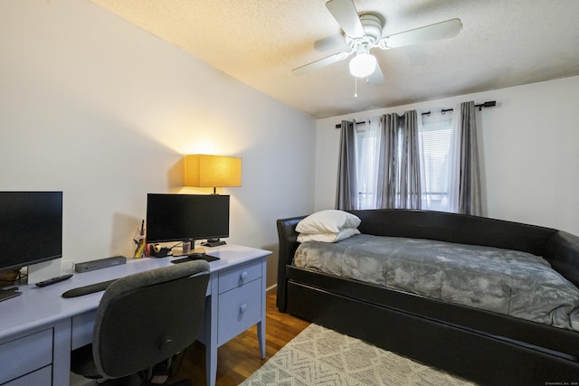 53 Roosevelt Blvd, Enfield, CT 06082 - bedroom with dark wood-type flooring, lofted ceiling, a desk, a textured ceiling, and ceiling fan