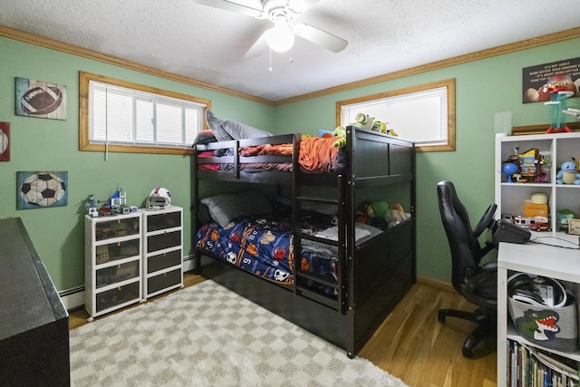 53 Roosevelt Blvd, Enfield, CT 06082 - bedroom featuring wood finished floors, ornamental molding, a desk, a baseboard radiator, and ceiling fan