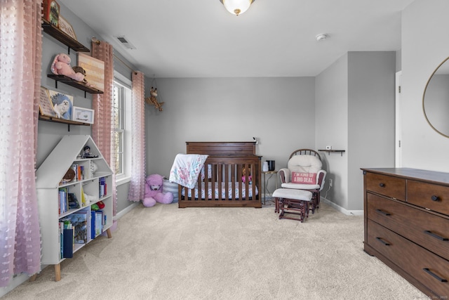 bedroom featuring light colored carpet and baseboards