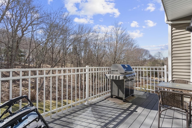 wooden terrace with a grill