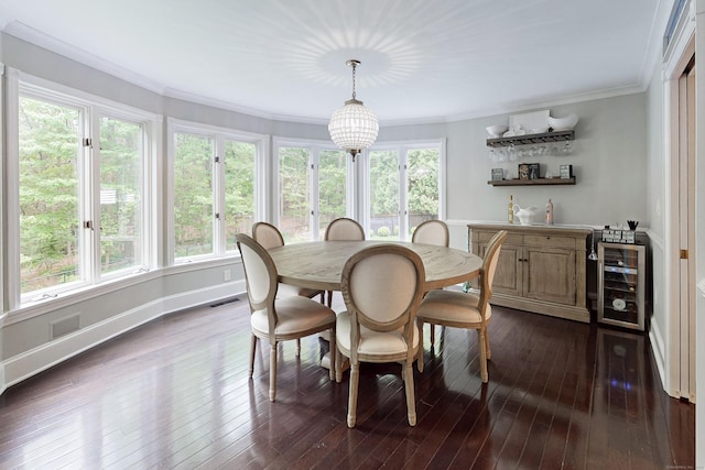 3 Inwood Ln, Woodbury, CT 06798 - dining area with wine cooler, dark wood finished floors, ornamental molding, and bar area